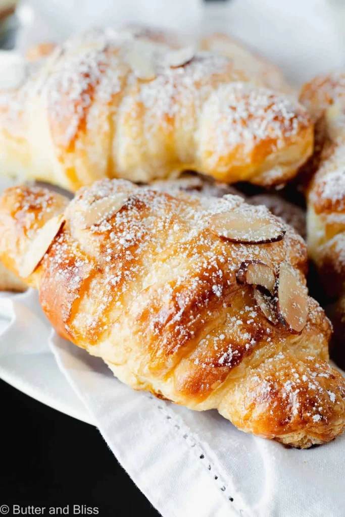 Delicious almond cream filled croissants on a plate