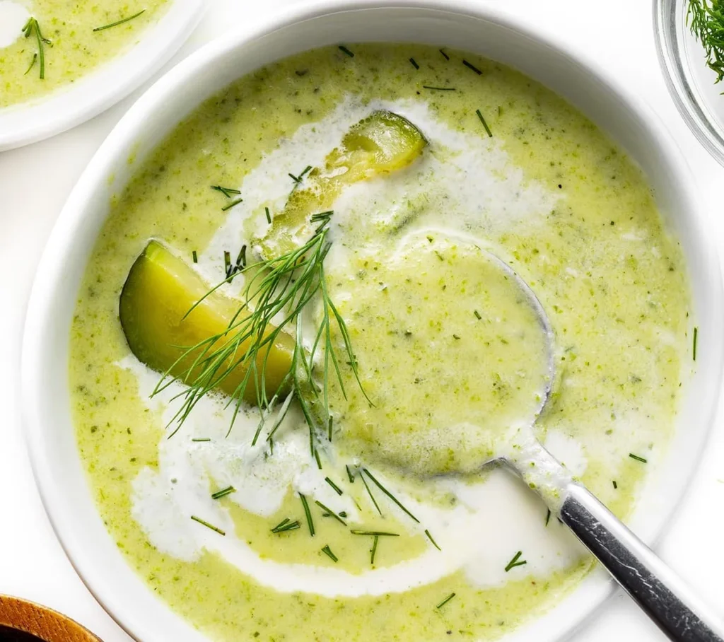 Bowl of easy and creamy zucchini soup garnished with herbs