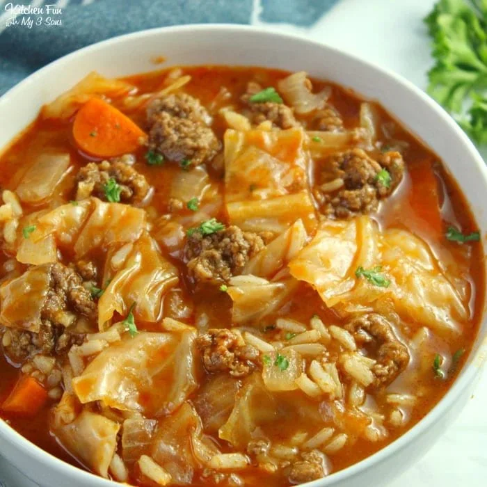 Delicious bowl of cabbage roll soup topped with fresh herbs