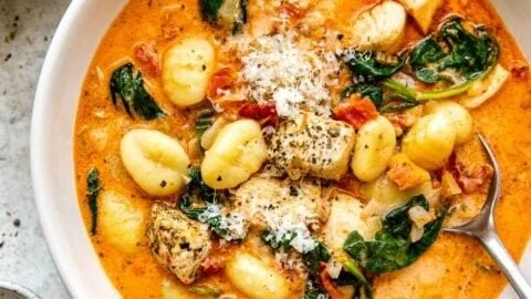 Bowl of creamy Marry Me Chicken Soup with herbs and ingredients