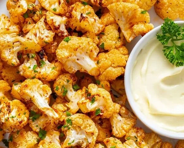 Crispy air fryer cauliflower served in a bowl with spices