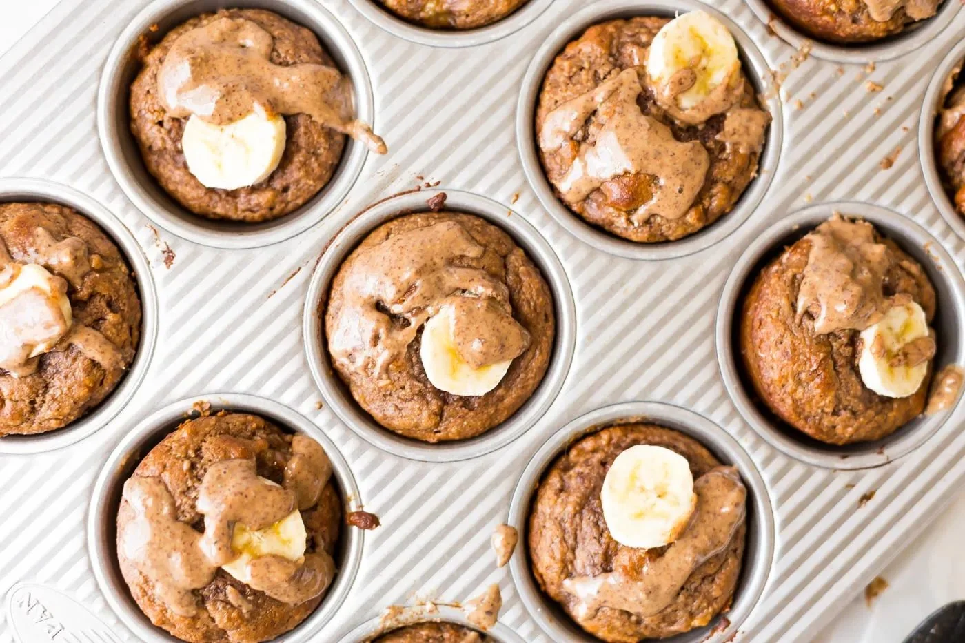 Delicious banana protein muffins arranged on a plate, perfect for a healthy snack.