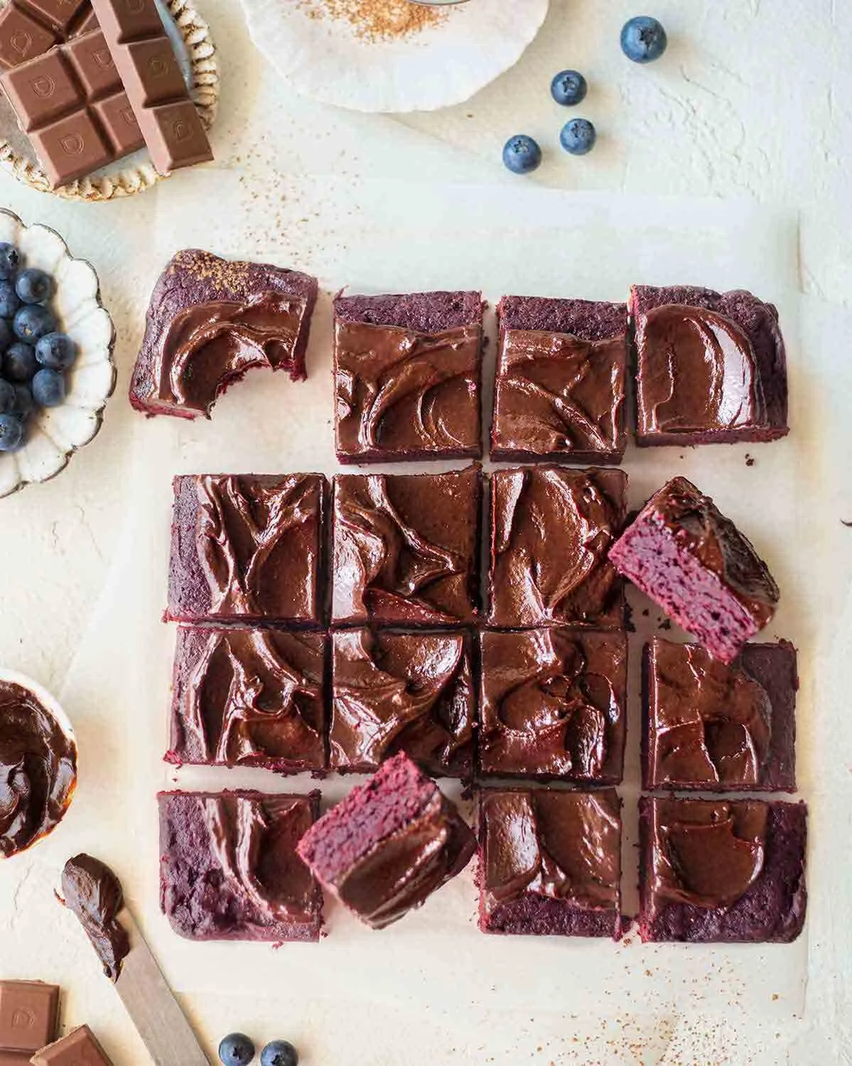 Delicious beetroot brownies with chocolate avocado frosting on a plate