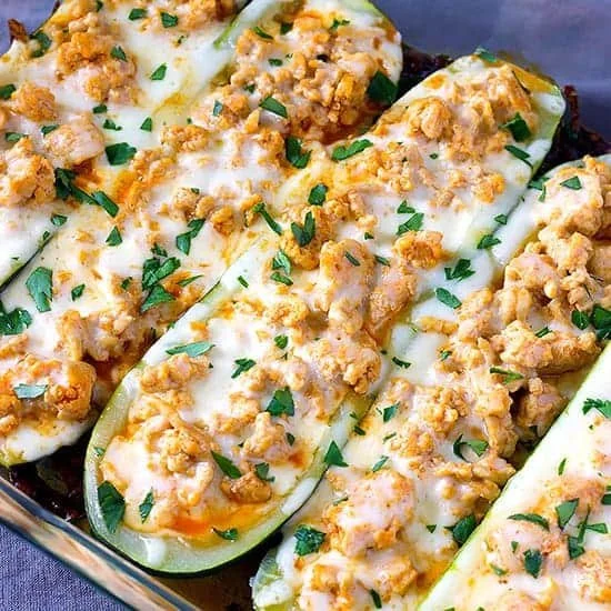 Buffalo Chicken Zucchini Boats garnished and ready to serve