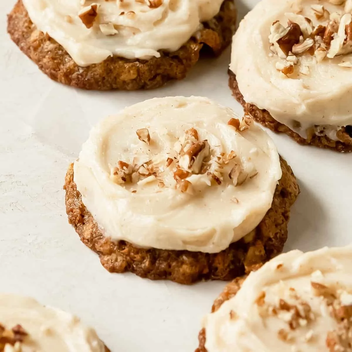 Freshly baked carrot cake cookies on a cooling rack