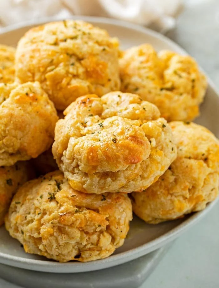 Freshly baked Cheddar Bay Biscuits served with melted butter and herbs