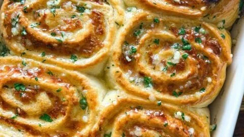 Cheesy garlic rolls fresh out of the oven, golden brown and cheesy