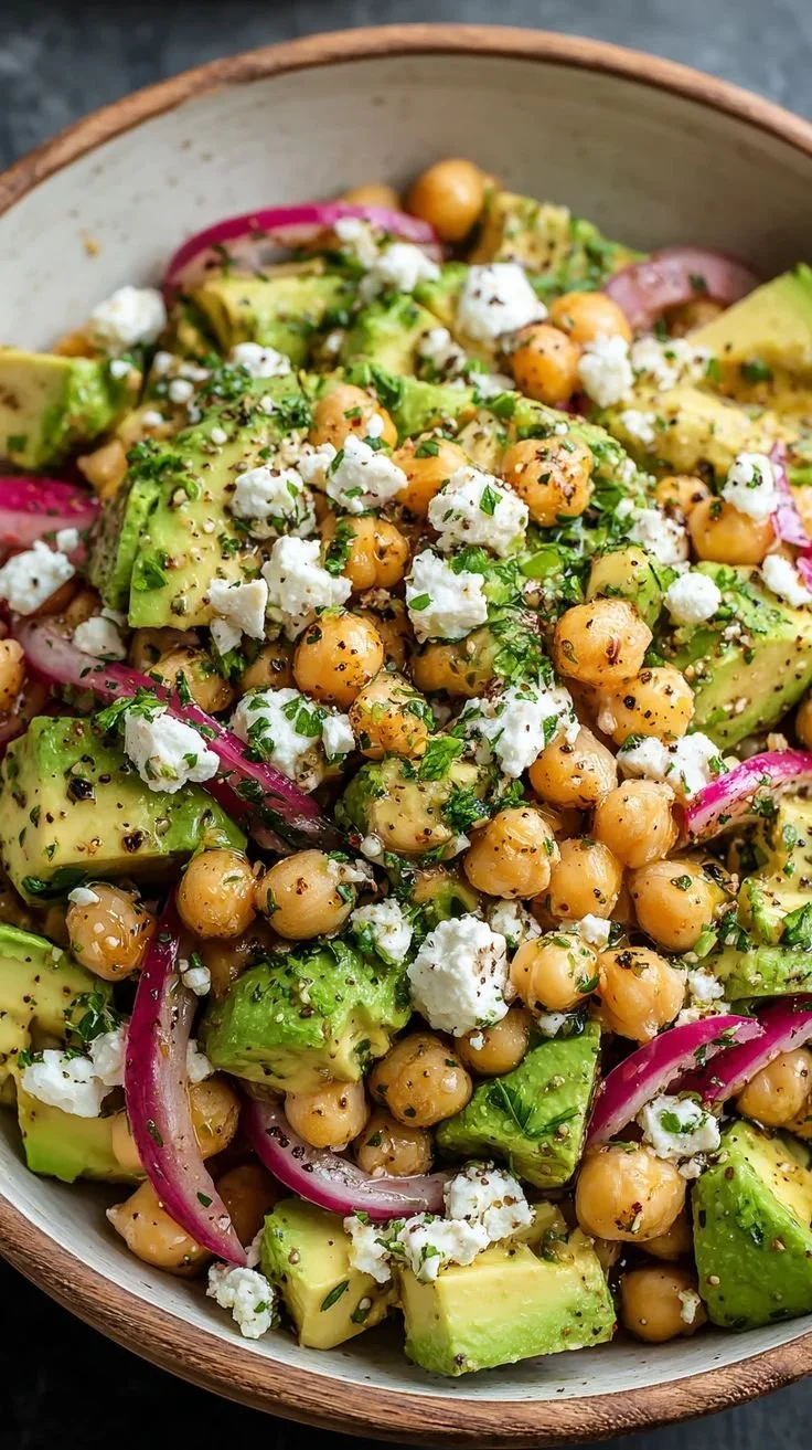 Chickpea Feta Avocado Salad with fresh ingredients in a vibrant bowl.
