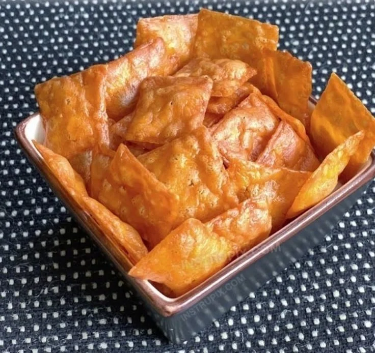 Crispy cheese squares served on a plate, golden and delicious.