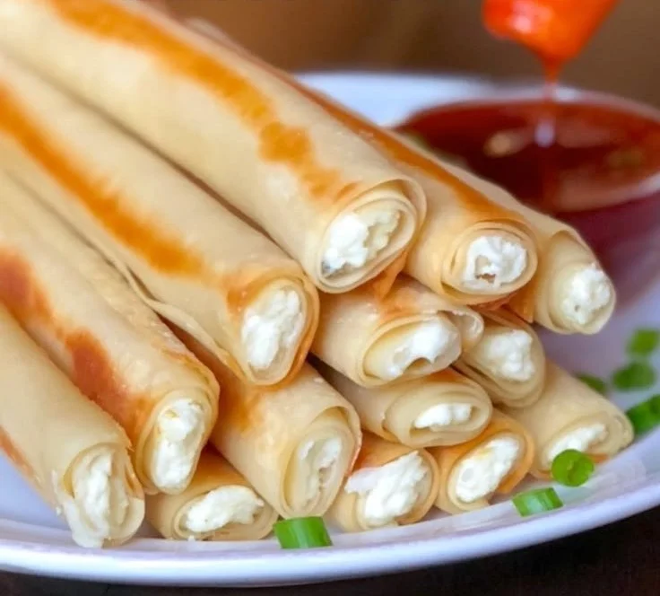 Delicious baked cream cheese rangoon rolls ready to serve