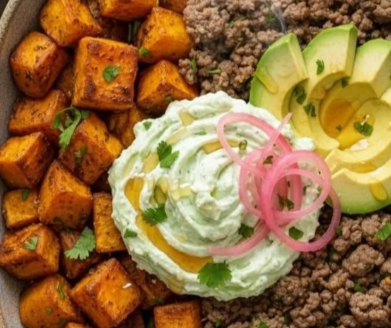 Ground Beef Sweet Potato Bowl with fresh vegetables and seasonings