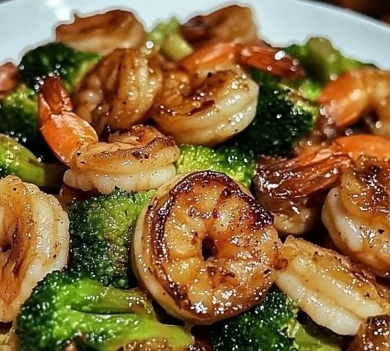 Delicious high-protein honey garlic shrimp served on a plate with vegetables