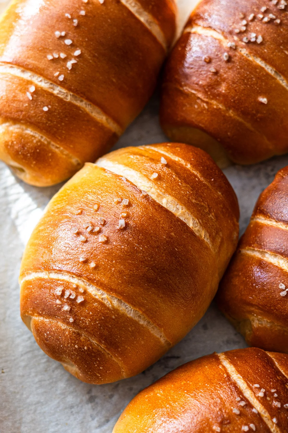 Loaf of no knead salt bread fresh out of the oven, golden crust and soft interior.