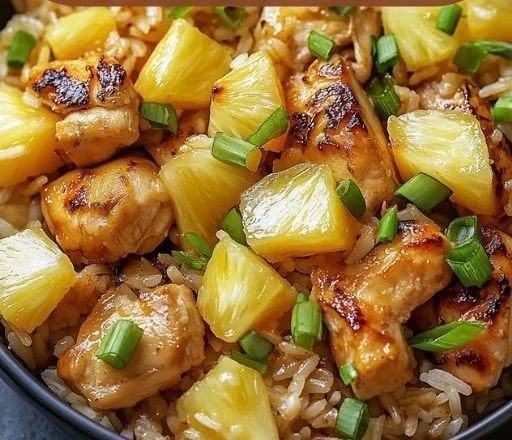 Delicious pineapple chicken served over rice with vibrant colors and flavors.