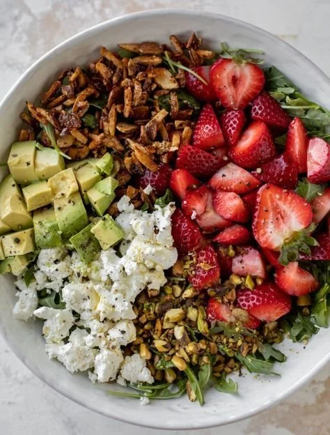 Delicious Strawberry Crunch Salad topped with Champagne Vinaigrette