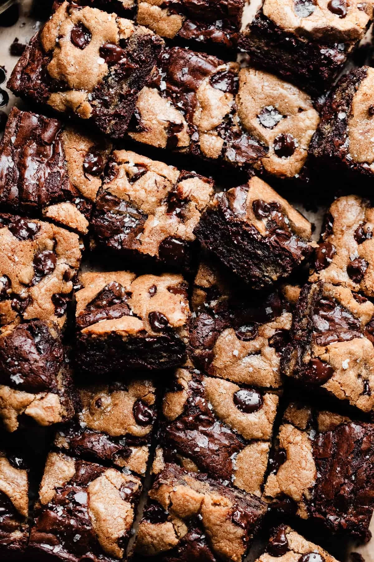 Delicious Brown Butter Brookies stacked on a plate, showcasing rich chocolate and fudgy texture.