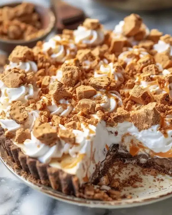 Delicious Butterfinger Pie with crispy Butterfinger candy topping