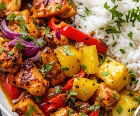 Hawaiian chicken sheet pan with colorful vegetables and pineapple slices
