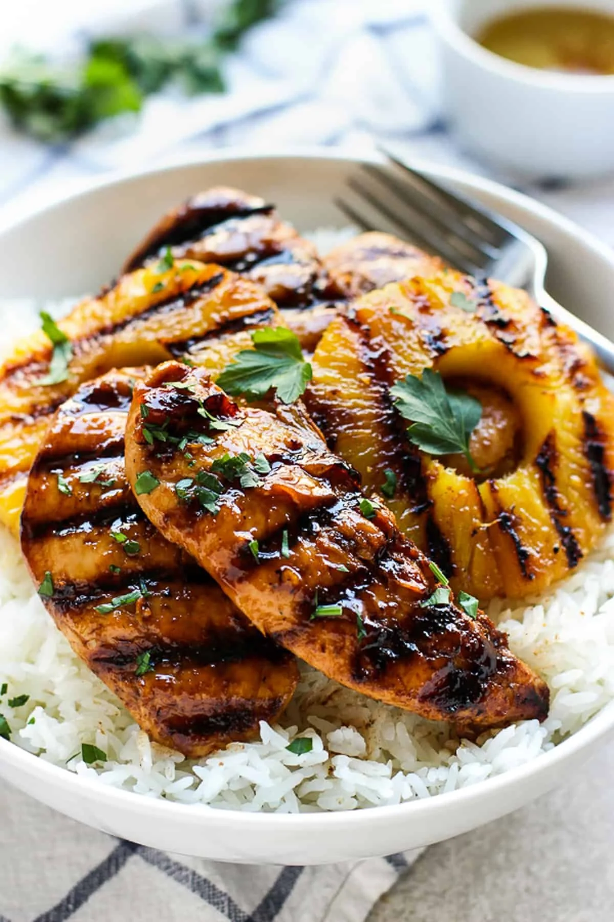 Hawaiian Chicken served with coconut rice on a plate.