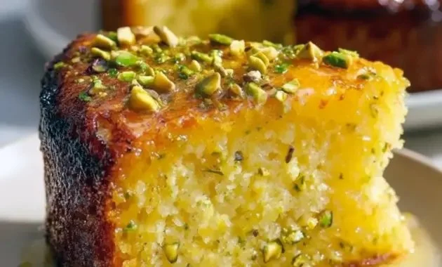 Delicious Flourless Lemon Pistachio Cake displayed on a rustic wooden table
