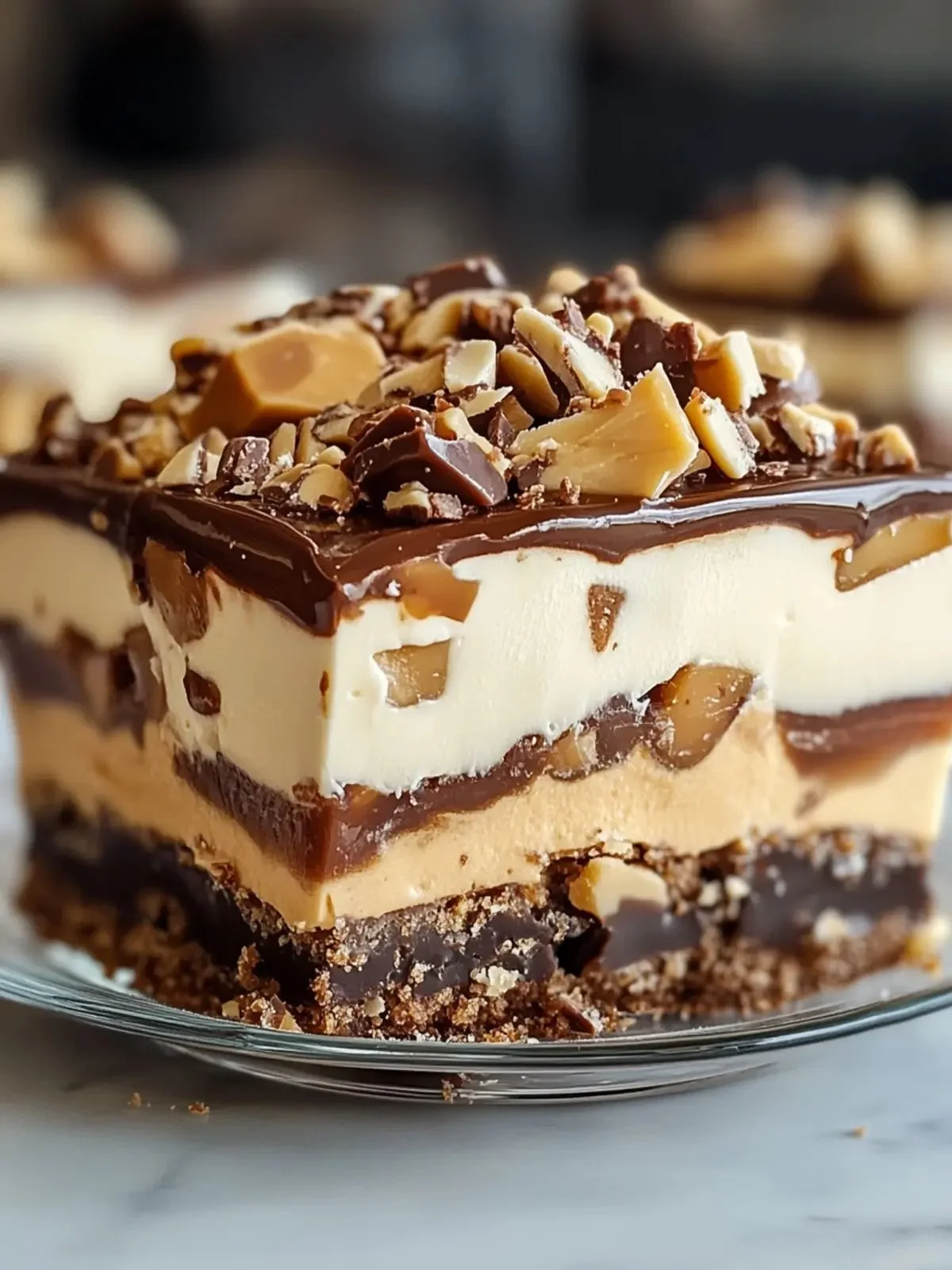 No Bake Turtle Lush dessert featuring layers of chocolate, caramel, and cream