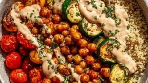 Delicious Roasted Chickpea and Veggie Bowl garnished for a healthy meal.